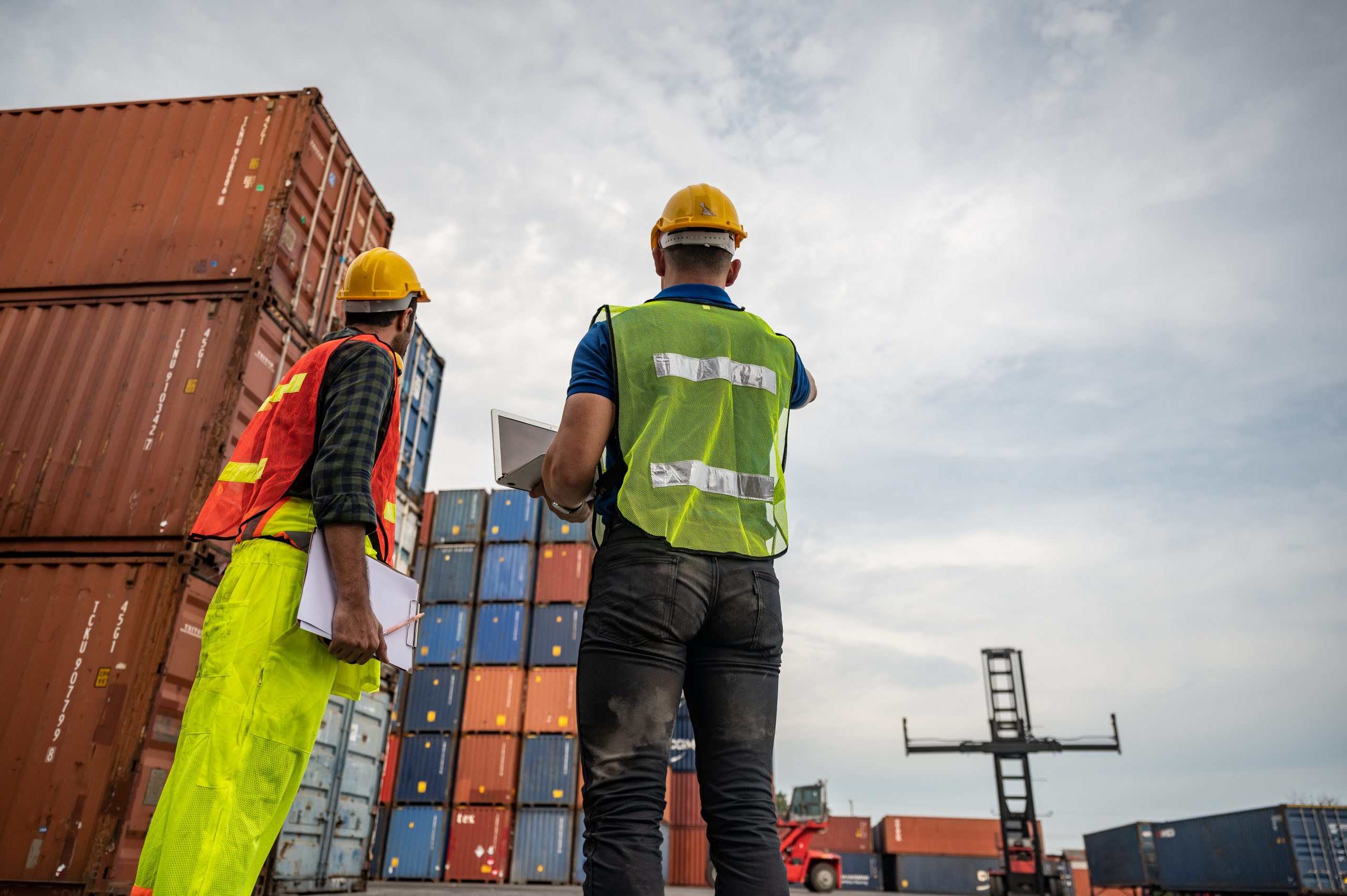 port employee checks containers in the container terminal, concept of logistic transporation international import and export